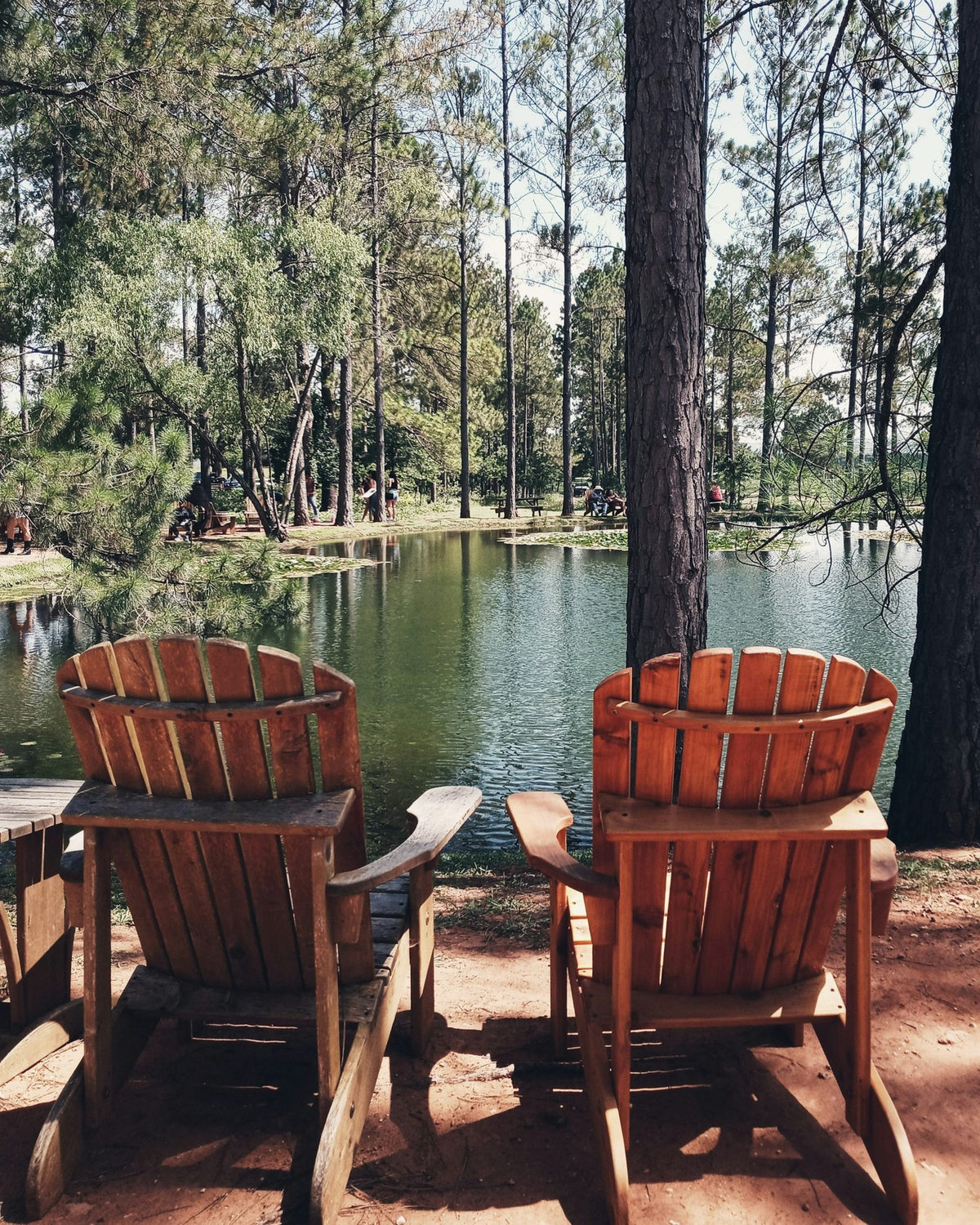 Two red chairs by the water in Fredericksburg, Texas