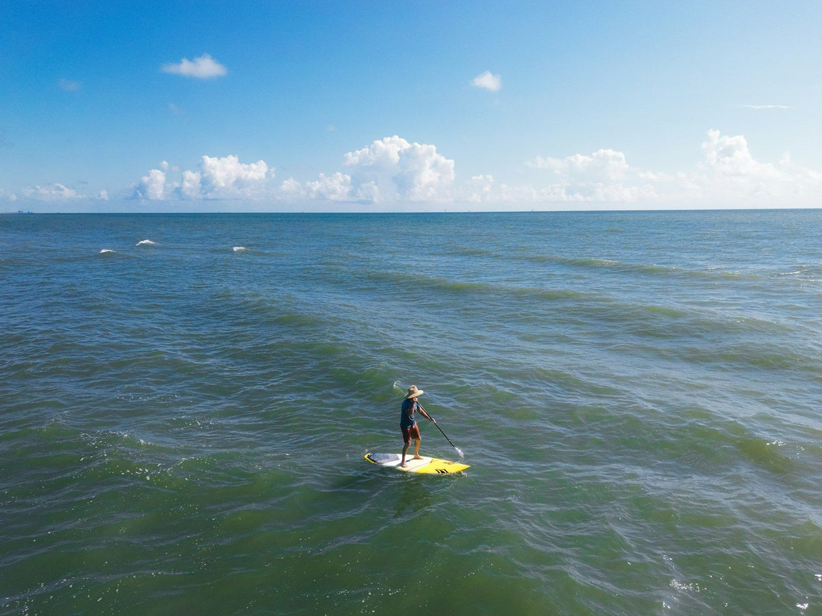 A paddleboarder on the Gulf off JP Luby Beach in Corpus Christi